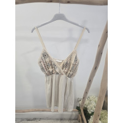 Blusa crema brillo pecho